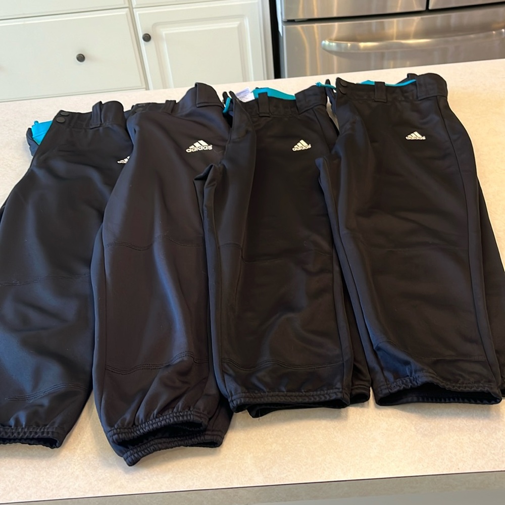 Four pairs of Adidas Softball Pants
